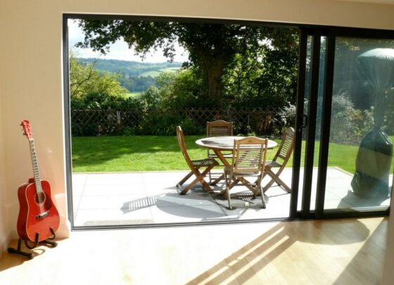 featured image - The Pros and Cons of Sliding Windows and Doors