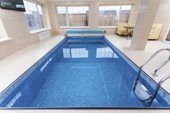 featured image - The Challenges and Risks of Having an Indoor Swimming Pool